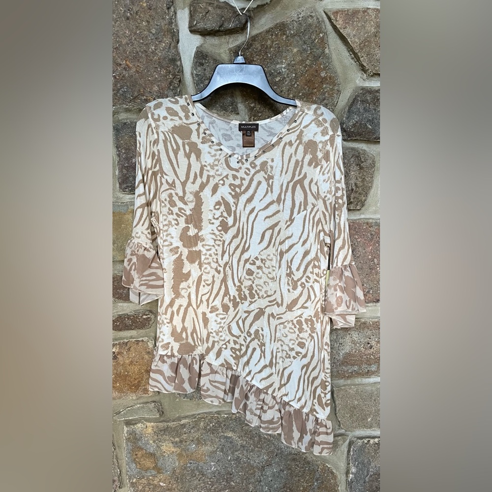 Multiples petites asymmetrical waist top. Flare sheer sleeve and bottom trim.